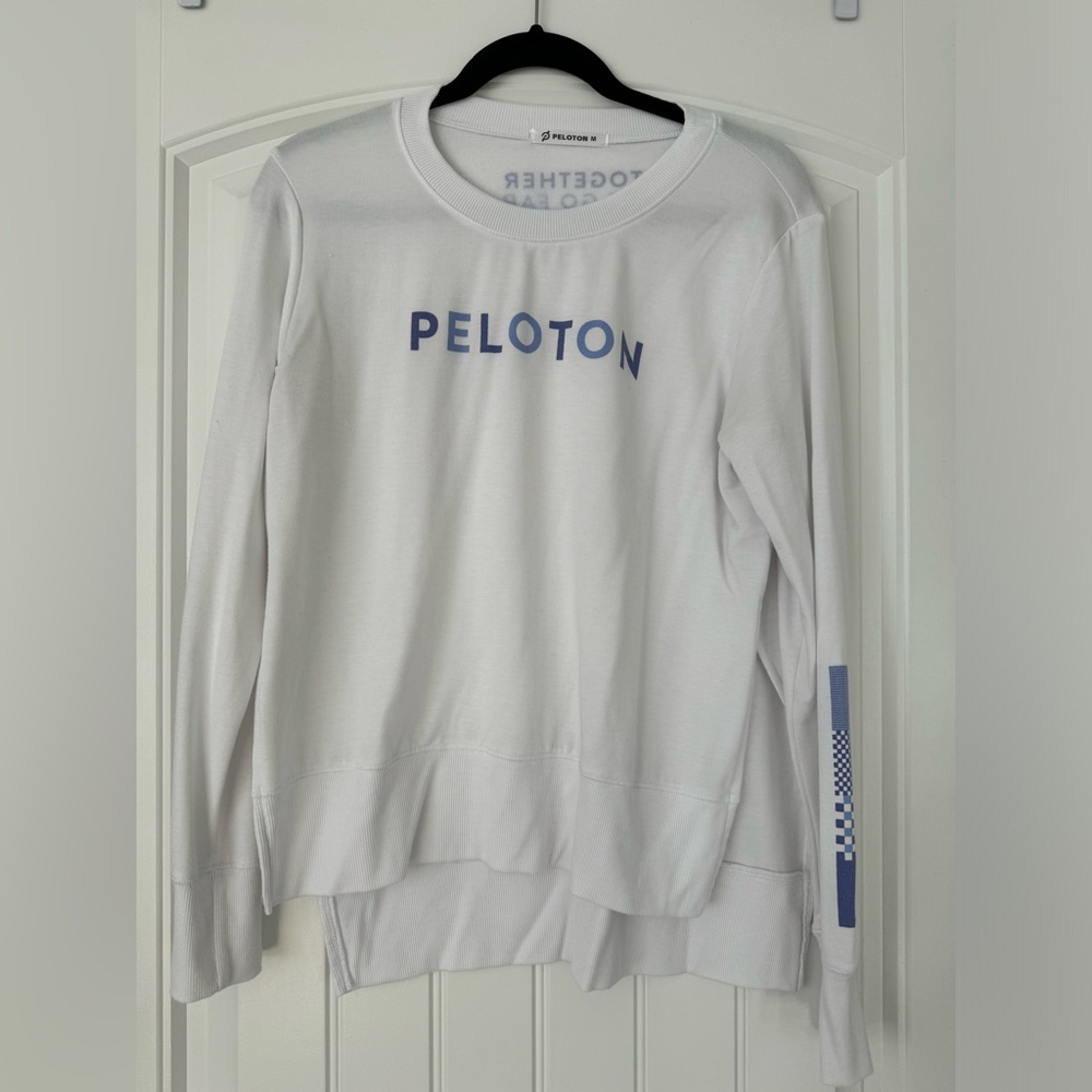 Incredibly soft white long sleeve peloton shirt.